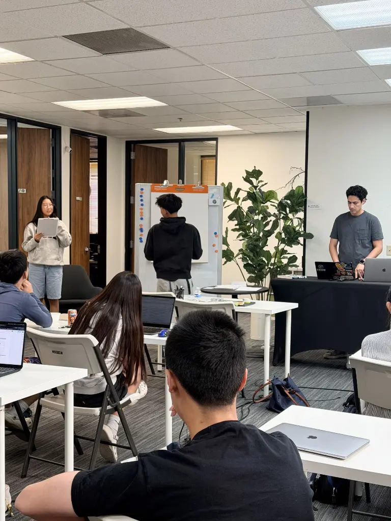 Student team presenting their project at the 7EDU Youth Entrepreneurship Program showcase
